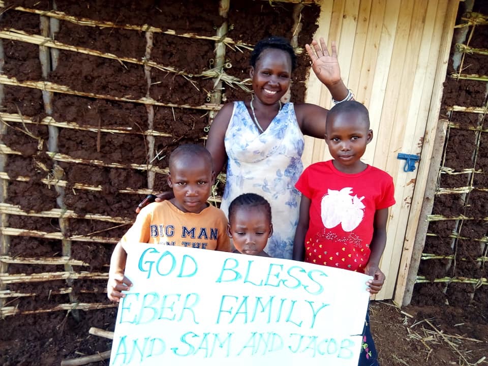 Widow and three boys with their new house